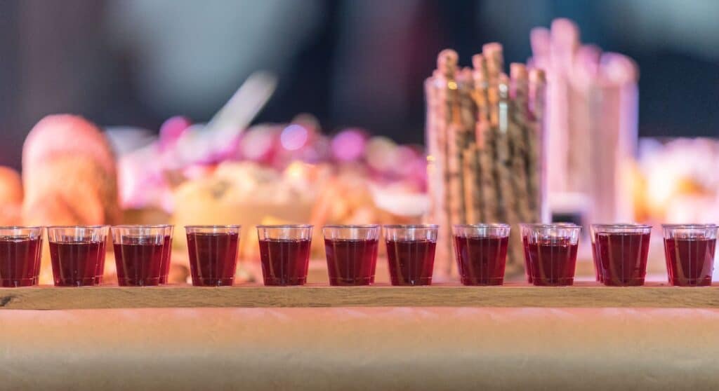  glasses filled with red liquid