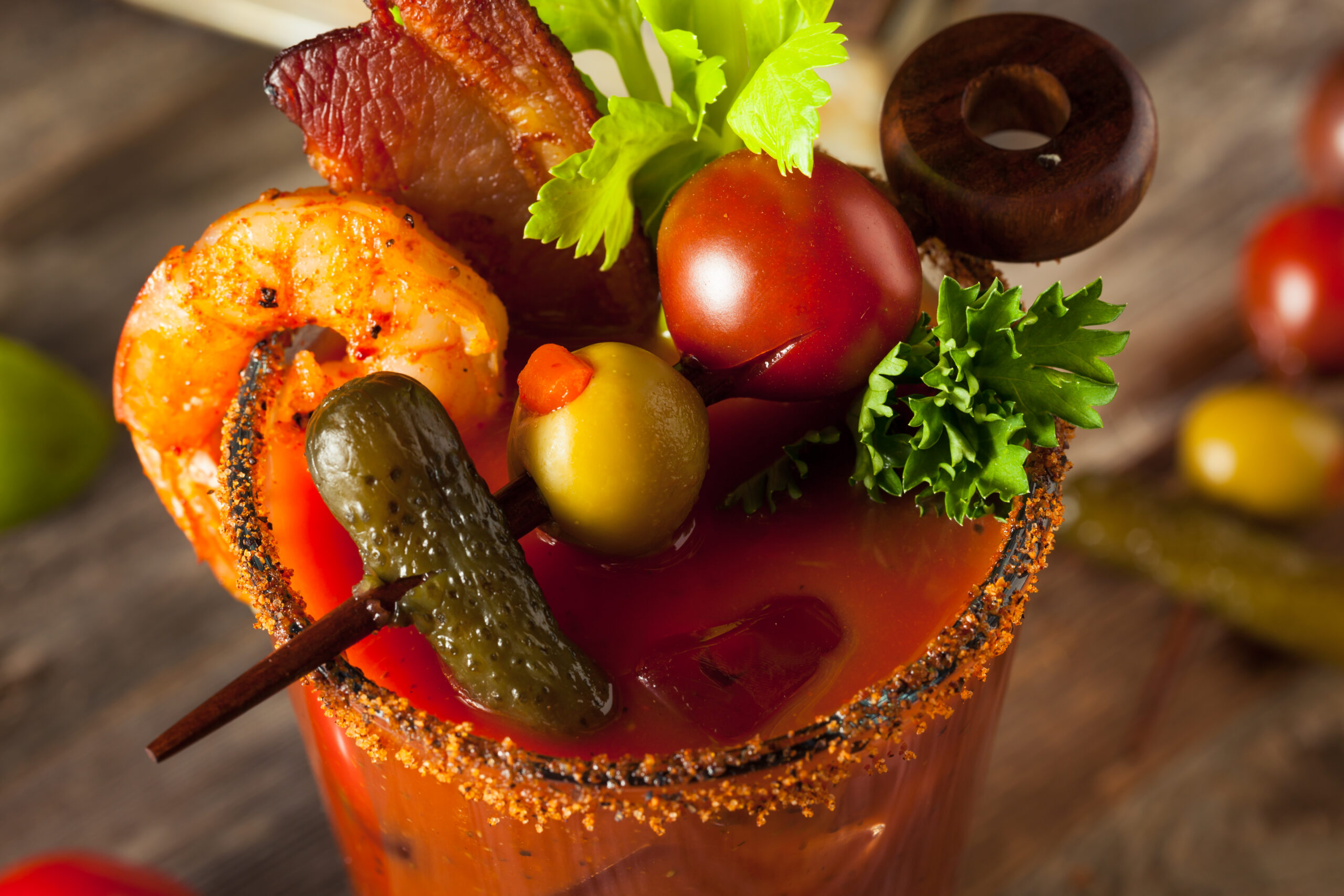 Bloody Mary with olive, pickle, tomato, salami and shrimp garnish