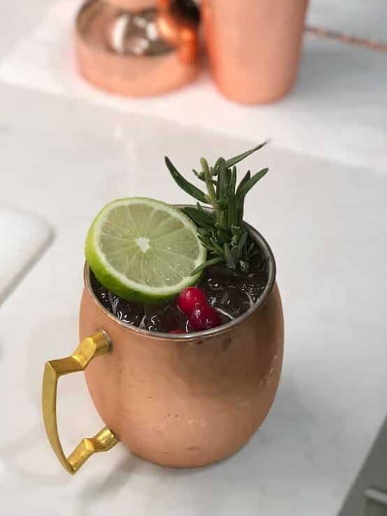 Mistletoe Mule cocktail in a copper mug