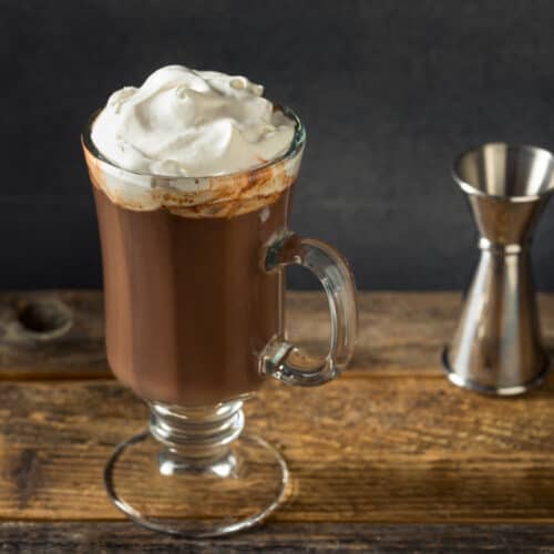 Spiked Hot Chocolate in a glass mug with a foamy top