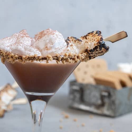 Toasted Smores Martini with marshmallow garnish and a graham cracker rim