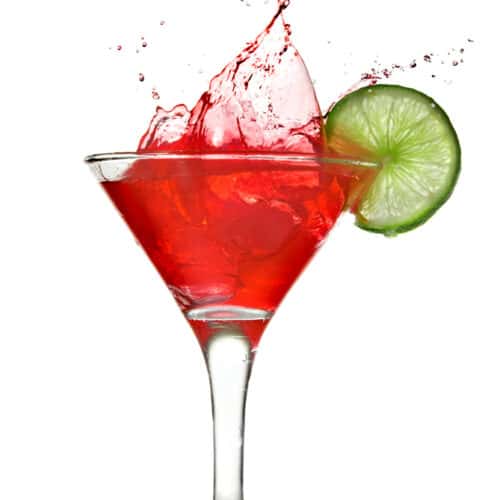 Cosmopolitan in a Martini glass with a lime garnish