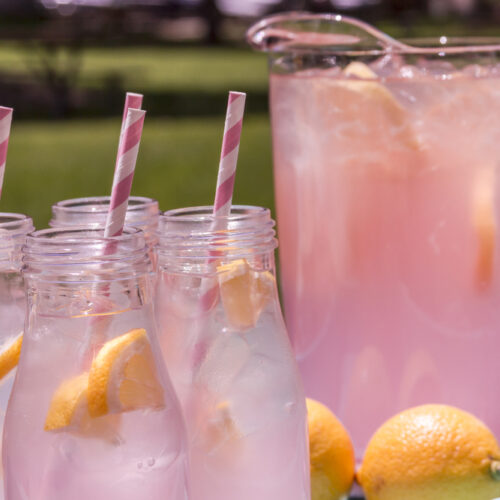 Rose Lemon Spritzer cocktails with a pitcher and straws