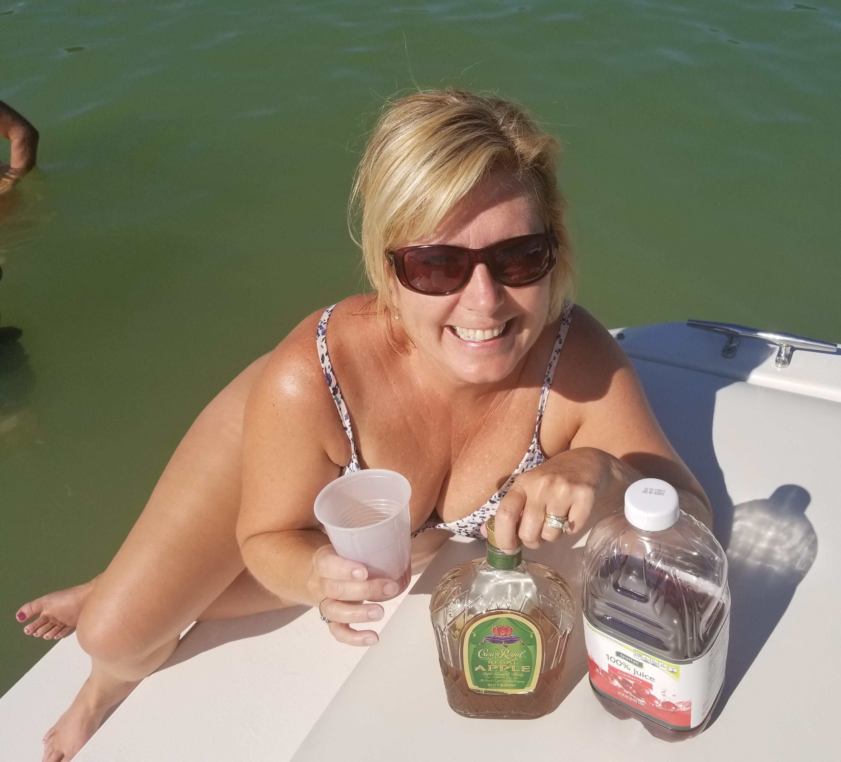 woman drinking on a boat