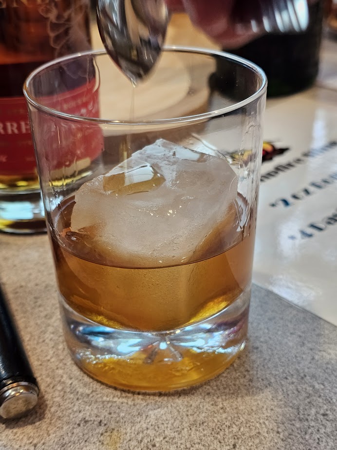 Cocktail Ice in a Campfire Sling