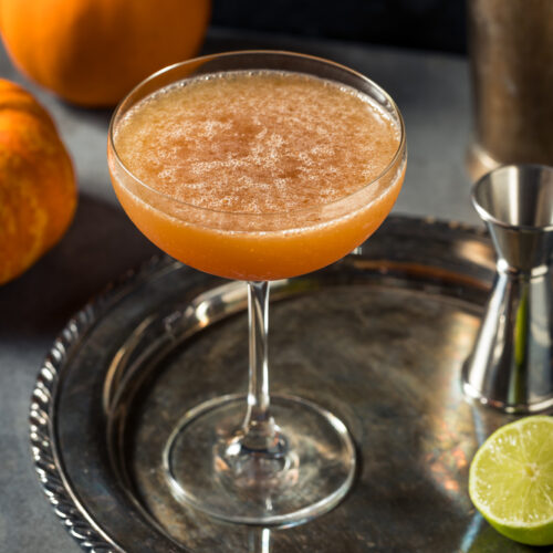 Pumpkin Spiced Margarita in a coup glass on a silver tray