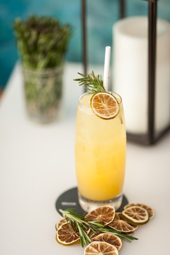 Holiday Punch with fruit and rosemary garnish