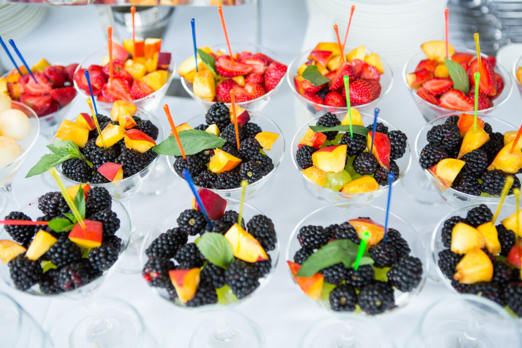Strawberries, Blackberries, Peach, and mint in cups for a Mimosa Bar