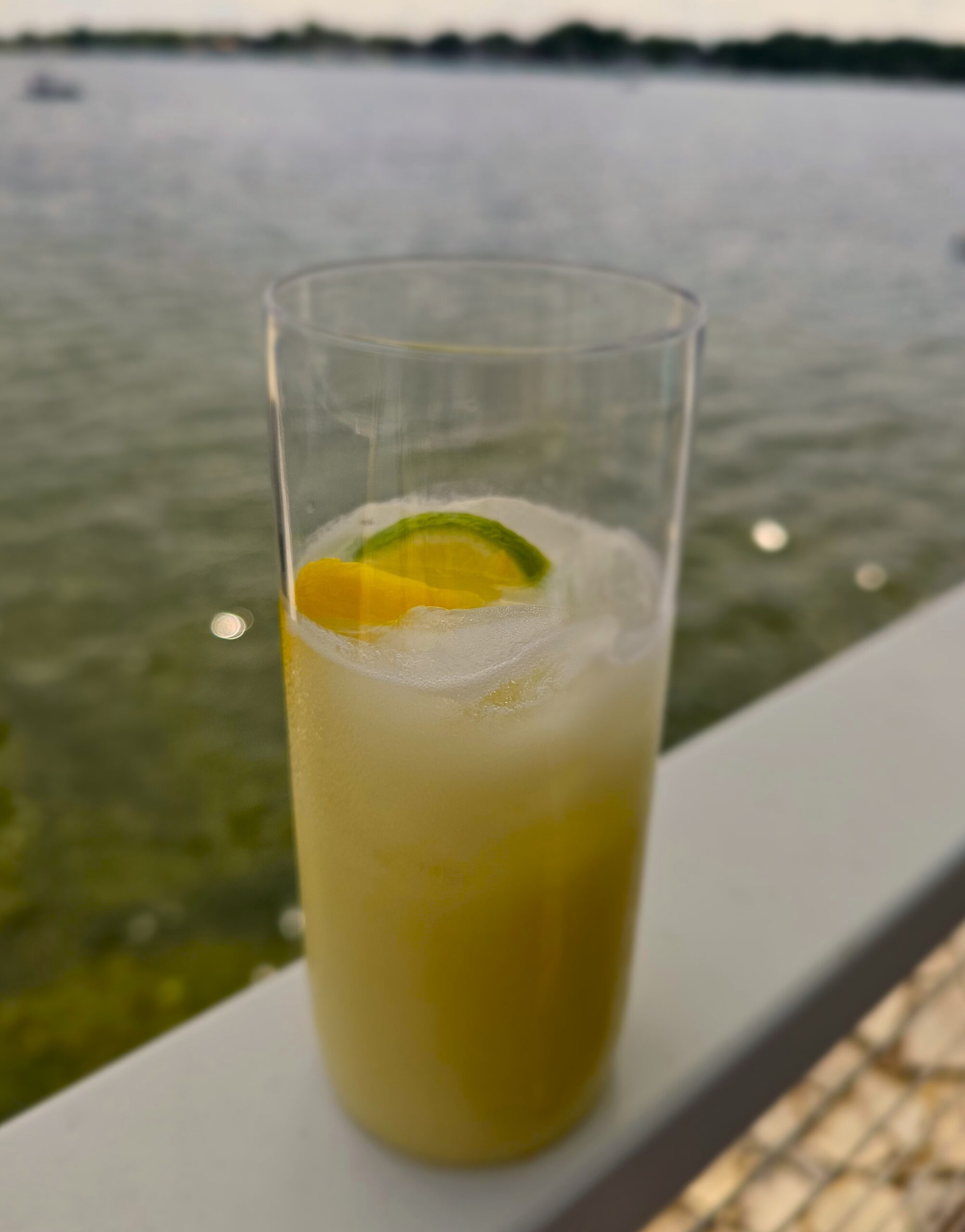 Coconut Margarita in a glass by the lake