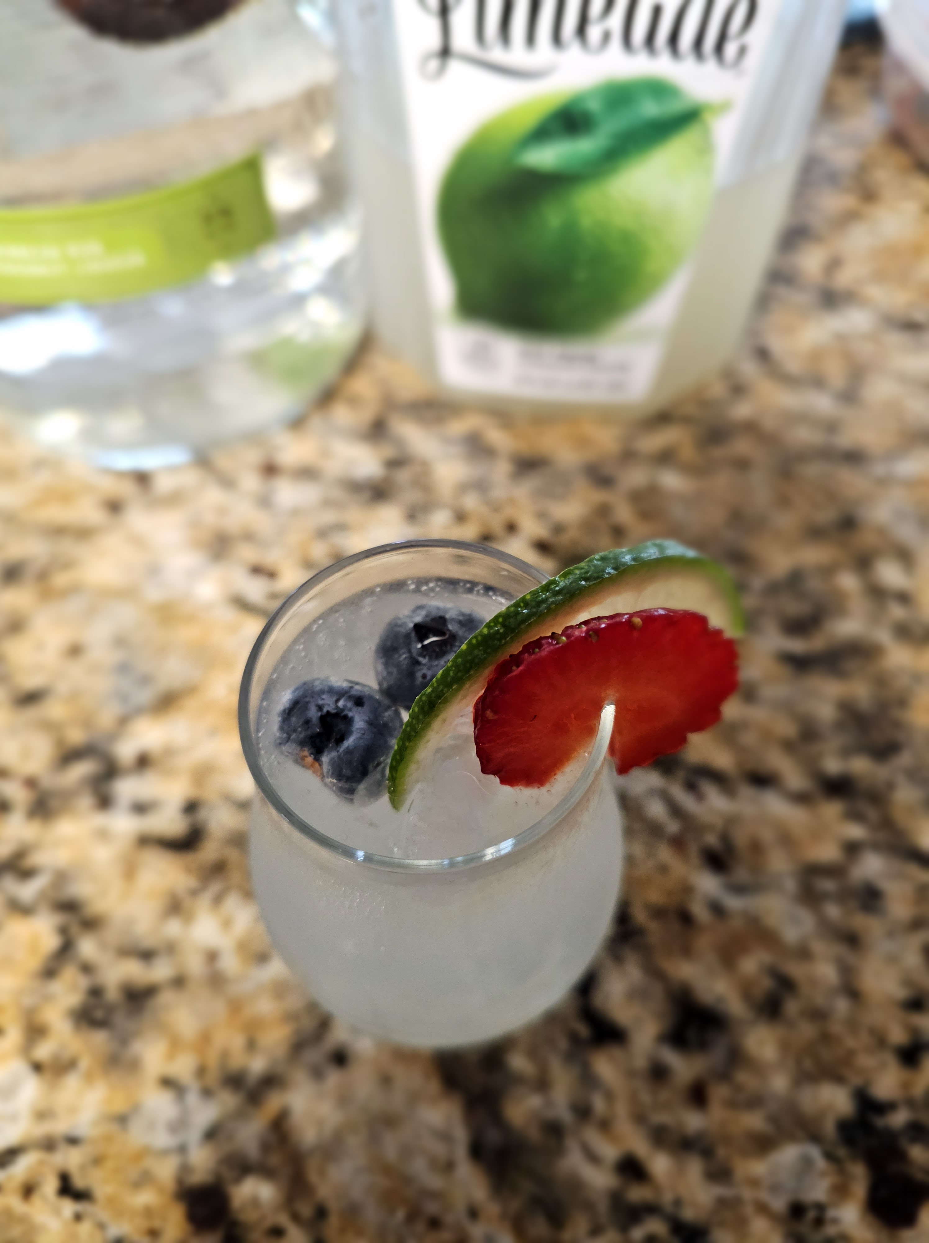 Rum Haven Limeade Cocktail with a strawberry garnish