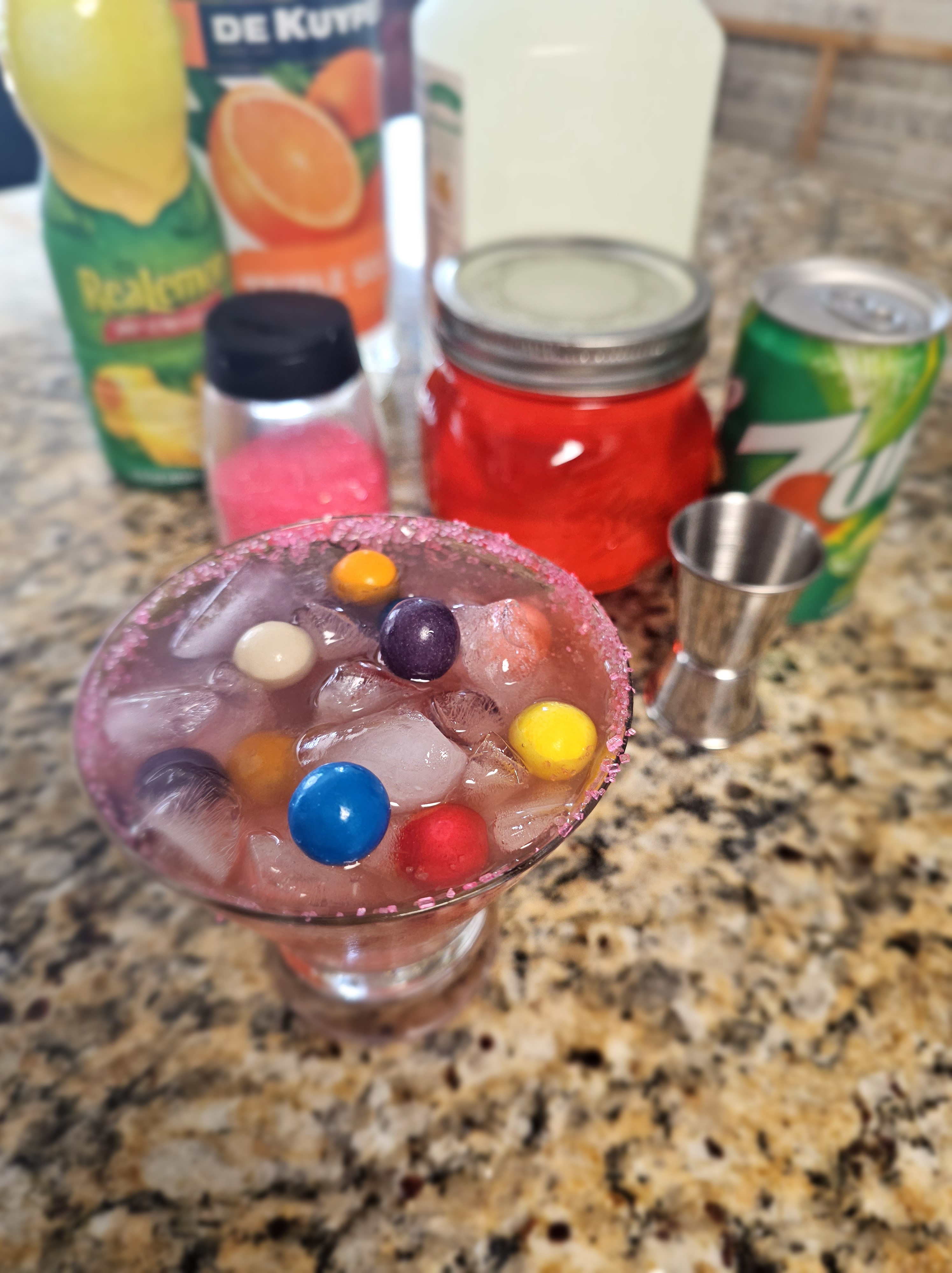 Hard Bubblegum Lemonade Cocktail with a sugar rim and ingredients