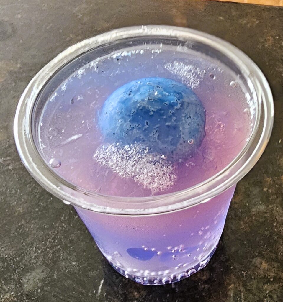 Hard Bubblegum Lemonade Shot with a blue gumball floating