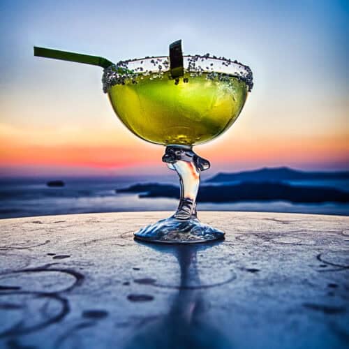 Cadillac Margarita at sunset with a straw