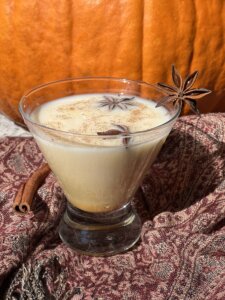 Creamy Cocktail in a stemless martini glass with star anise garnish