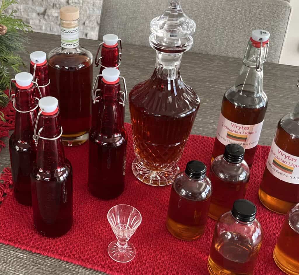 A selection of bottles with an amber liqueur in them.