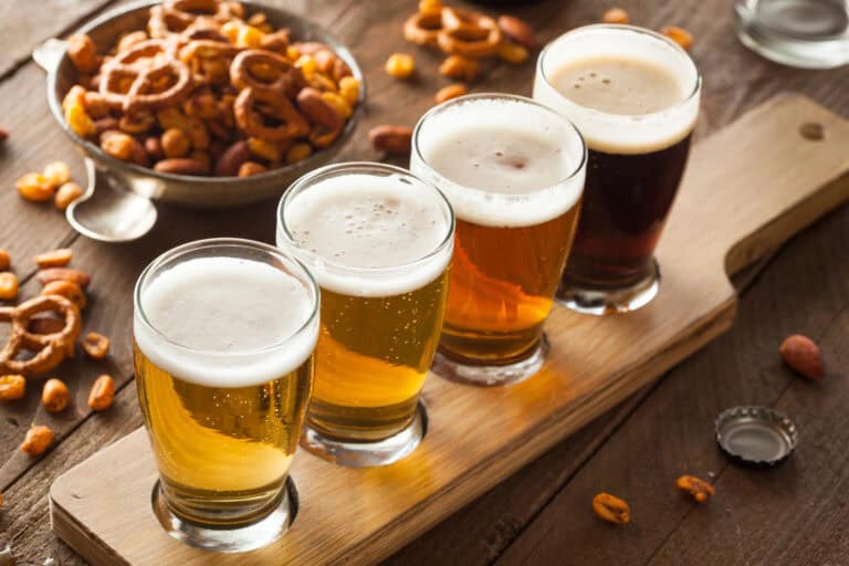 Beer Flight with snacks in bowls on the side