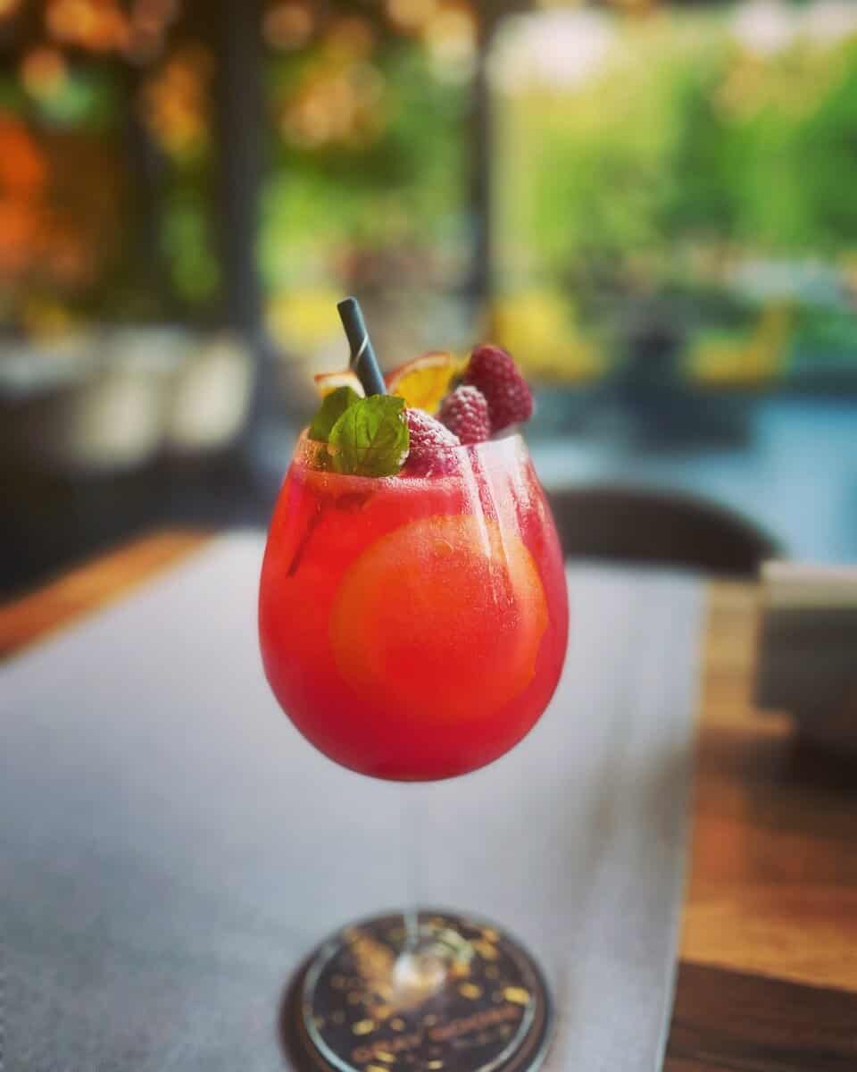 Crown Royal Cocktail with fruit in a wine glass