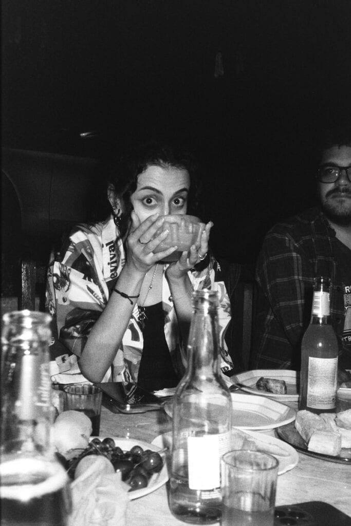 Lady drinking black and white
