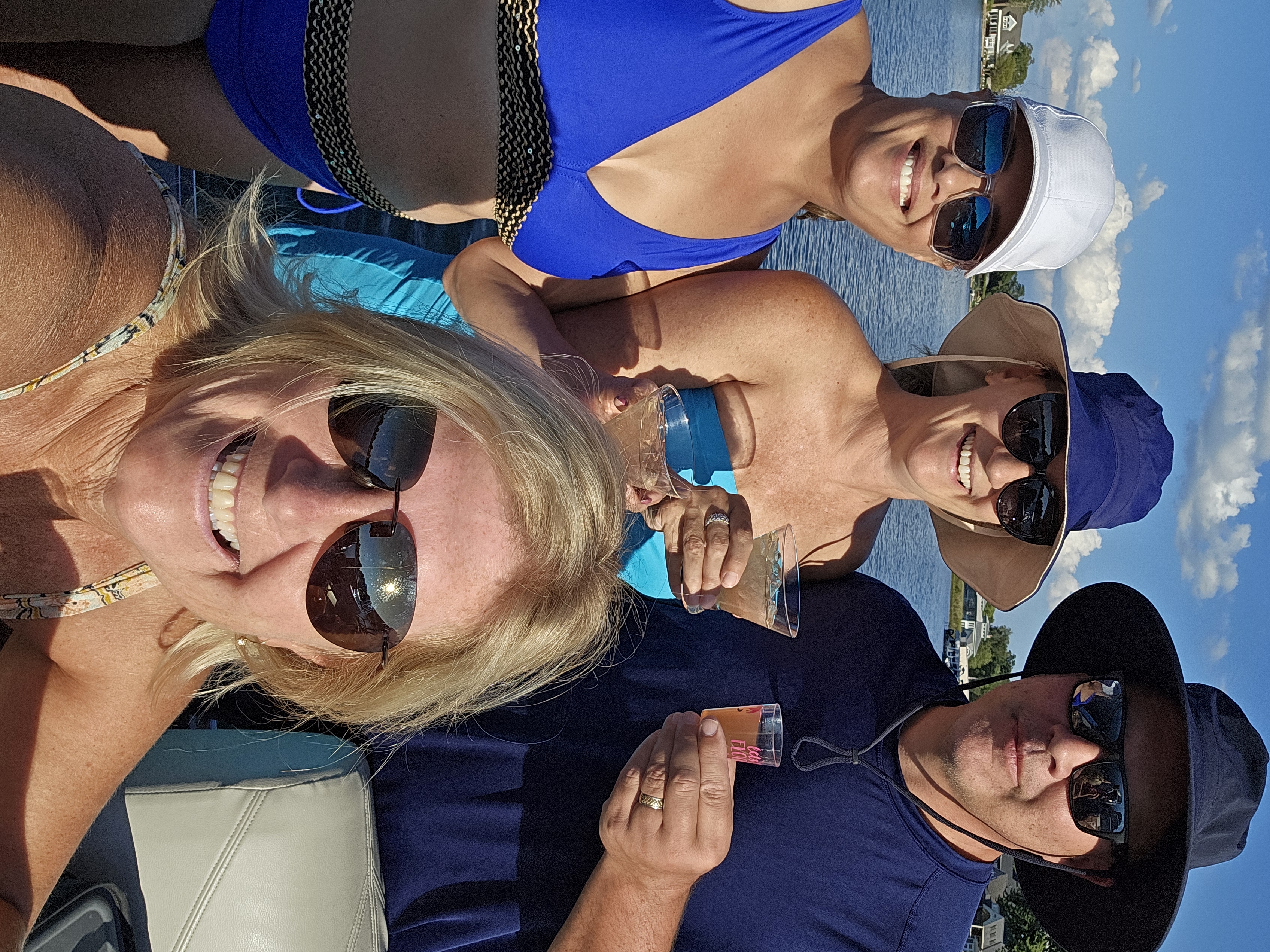 Group of people enjoying a cocktail on the lake