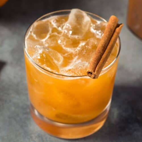 Halloween Cocktail with Bourbon and a cinnamon stick as garnish.