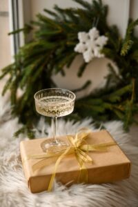 a glass of wine sitting on top of a box