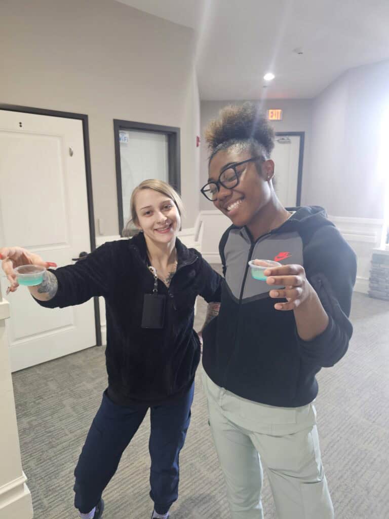 Two women toasting Happy Hour