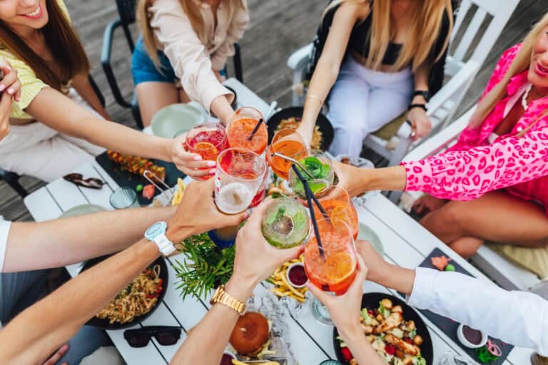 Group of people Pregaming at home with cocktails