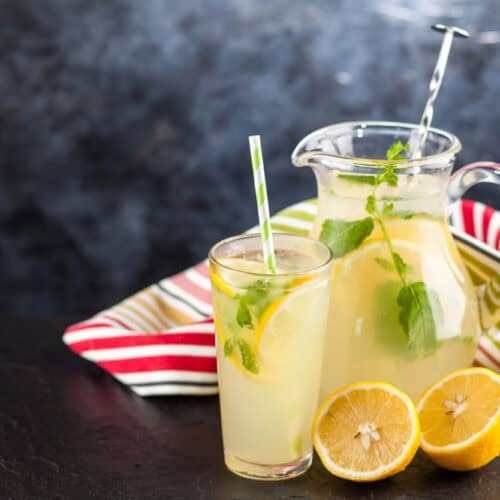 Pitcher of Limoncello Hugo Spritz with a glass and a straw